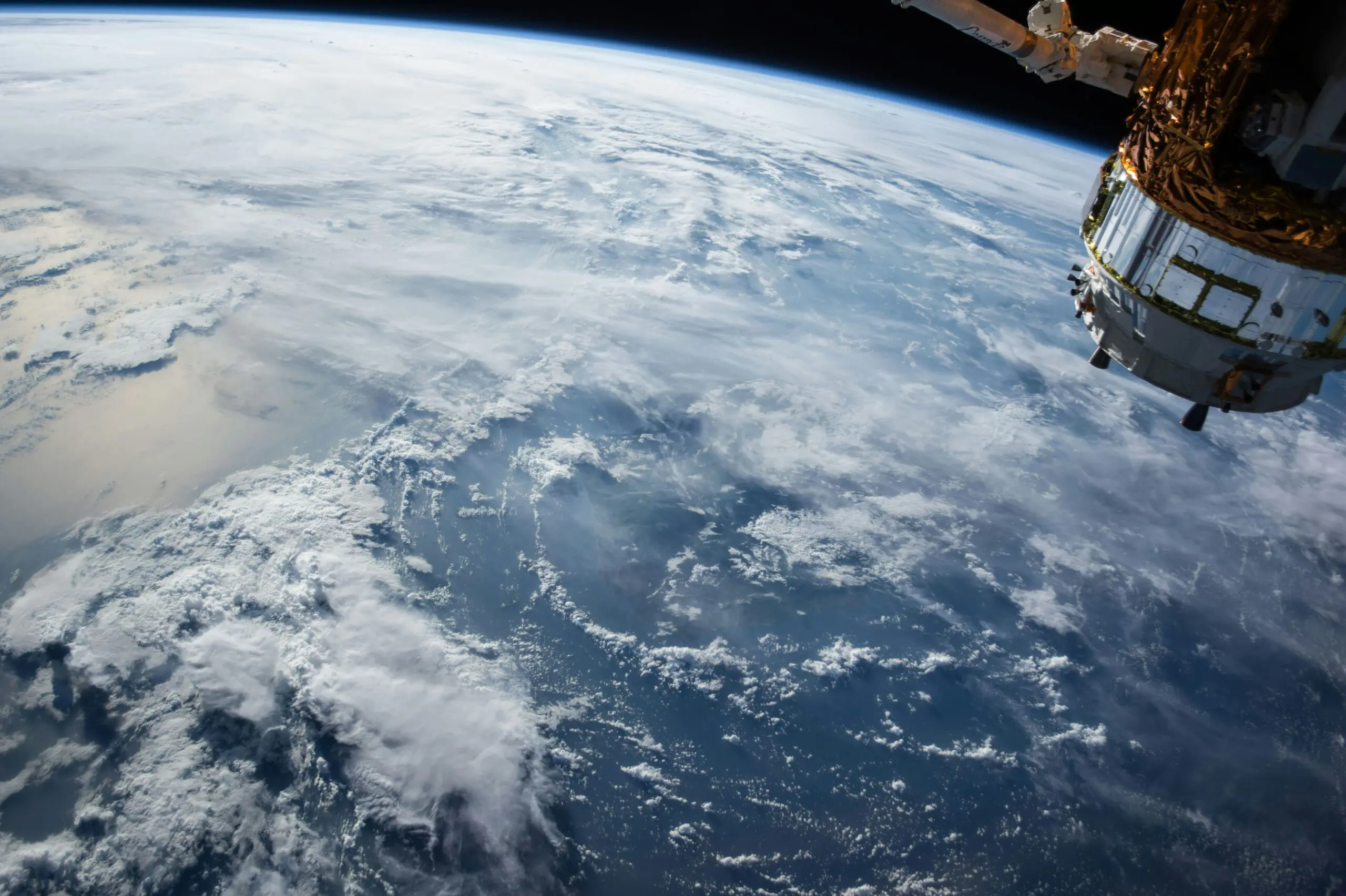 Earth viewed from space, with a satellite in view