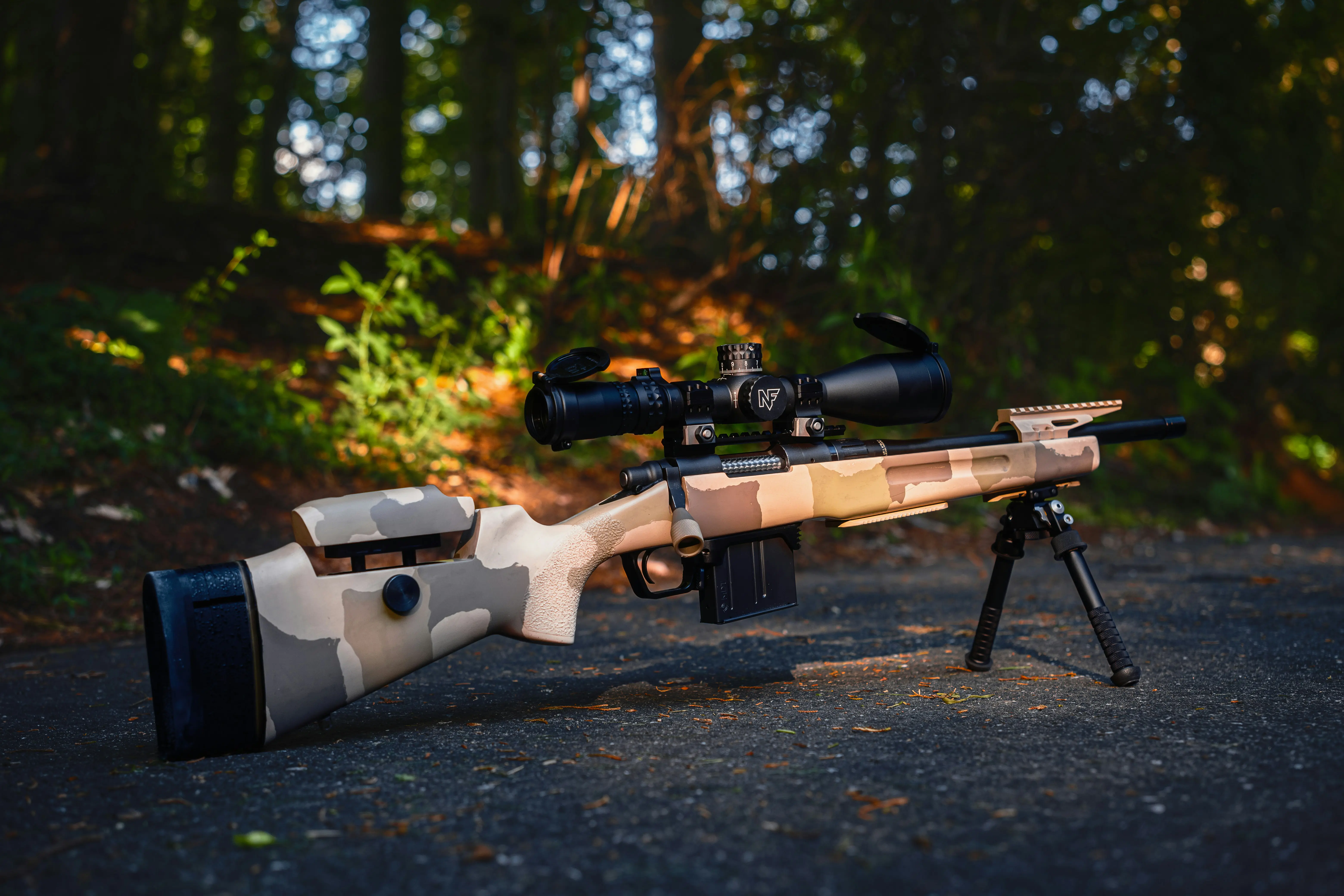 Nightforce Optics precision riflescope mounted on a tactical rifle requiring accurate riflescope collimation.