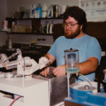 Bob Jacobsen polishing a lens