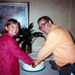 Betsy and Steve Fantone cut Optikos 30th anniversary cake, Sept. 9, 2012