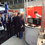 Optical engineers, Dave Biss and Will Rusin with booth visitors, Laser Munich, 2015