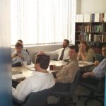 Conference room containing Steve Fantone, Roy Youman, John Everett, Beth Risbick, Scott Nathan, and David Imrie