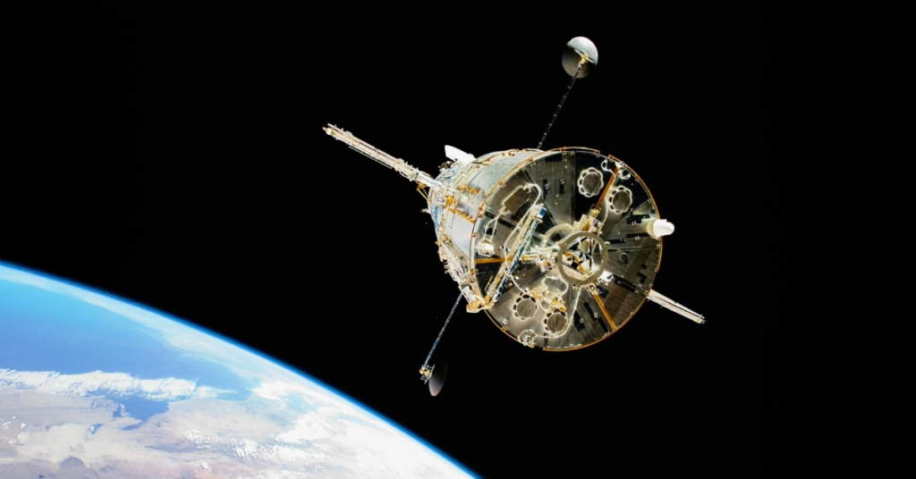 Hubble From Behind (2009) Caption The Space Shuttle Atlantis moves away from Hubble after the telescope's release on May 19, 2009 concluded Servicing Mission 4. The Soft Capture Mechanism, a ring that a future robotic mission can grapple in order to de-orbit the telescope, is visible in the center. Credits NASA